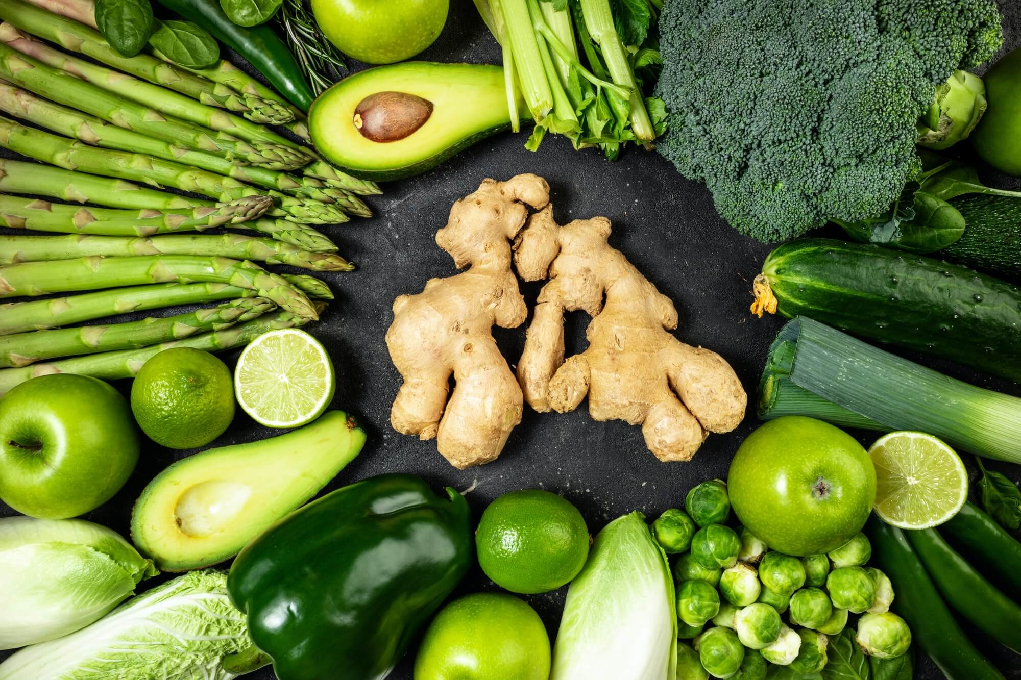 healthy food clean eating green vegetables fruits and ginger on dark stone background 1